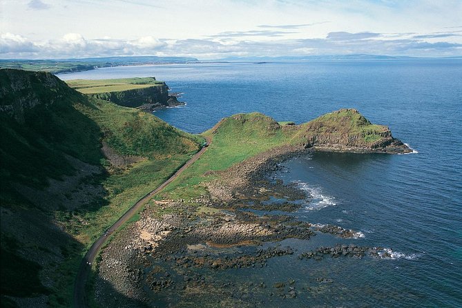 Giant's Causeway and Whisky Distillery tasting tour from Belfast - Dunluce Castle: the 5-minute photo stop that sets the tone